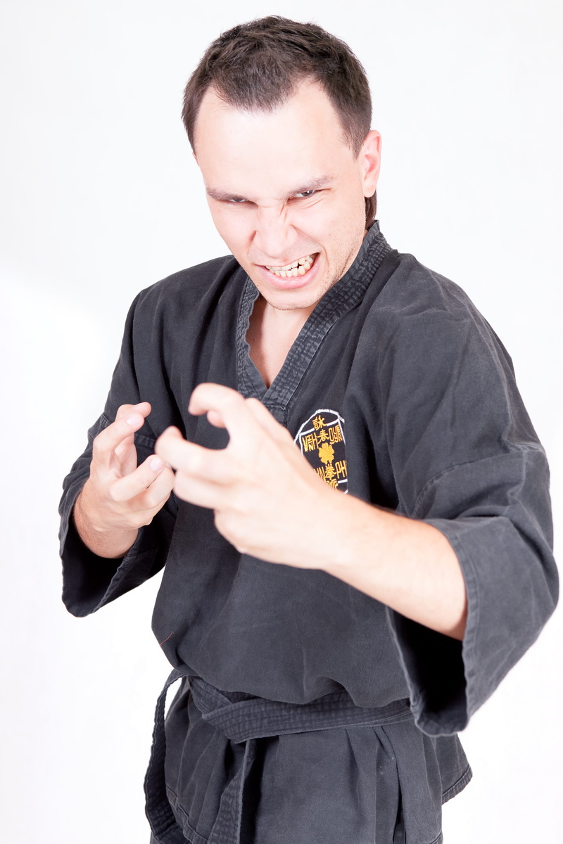young adult, lifestyles, con2011, 2K, technology, smiling, one person, kungfu, black color, fighter, waist up, studio shot, health, standing, white background