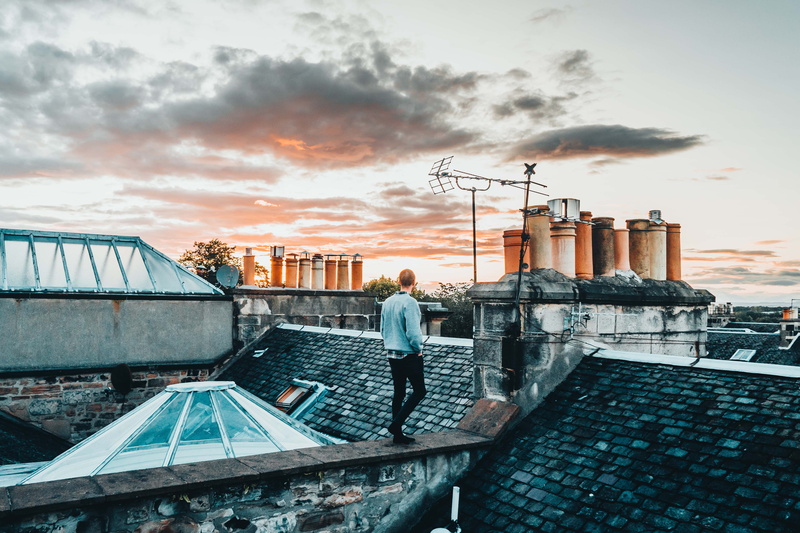 nature, cloud - sky, architecture, lifestyles, full length, abn, gray, sunlight, roof, tile, cityscape, cloudy, outdoors, man, standing, adult, sweater