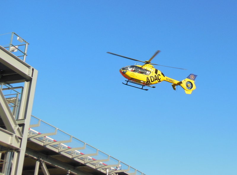 helicopter, rescue helicopter, sunny, outdoors, blue, accident rescue, no people, mid-air, yellow, christophorus, day, low angle view, air vehicle, motion