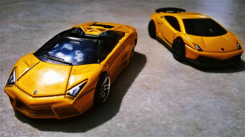 no people, yellow, taxi, car, day, toy car, cars, land vehicle, yellow taxi, die, transportation, mode of transportation, high angle view, Lamborghini