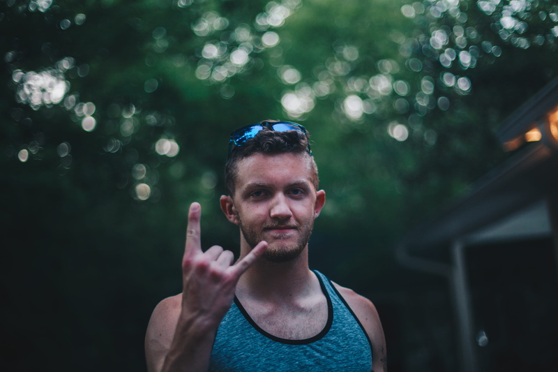beard, top, adult, blur, sunglasses, dark, male, mid adult, human, looking at camera, tank top, tank, standing, front view, teal, outdoors, chapel hill