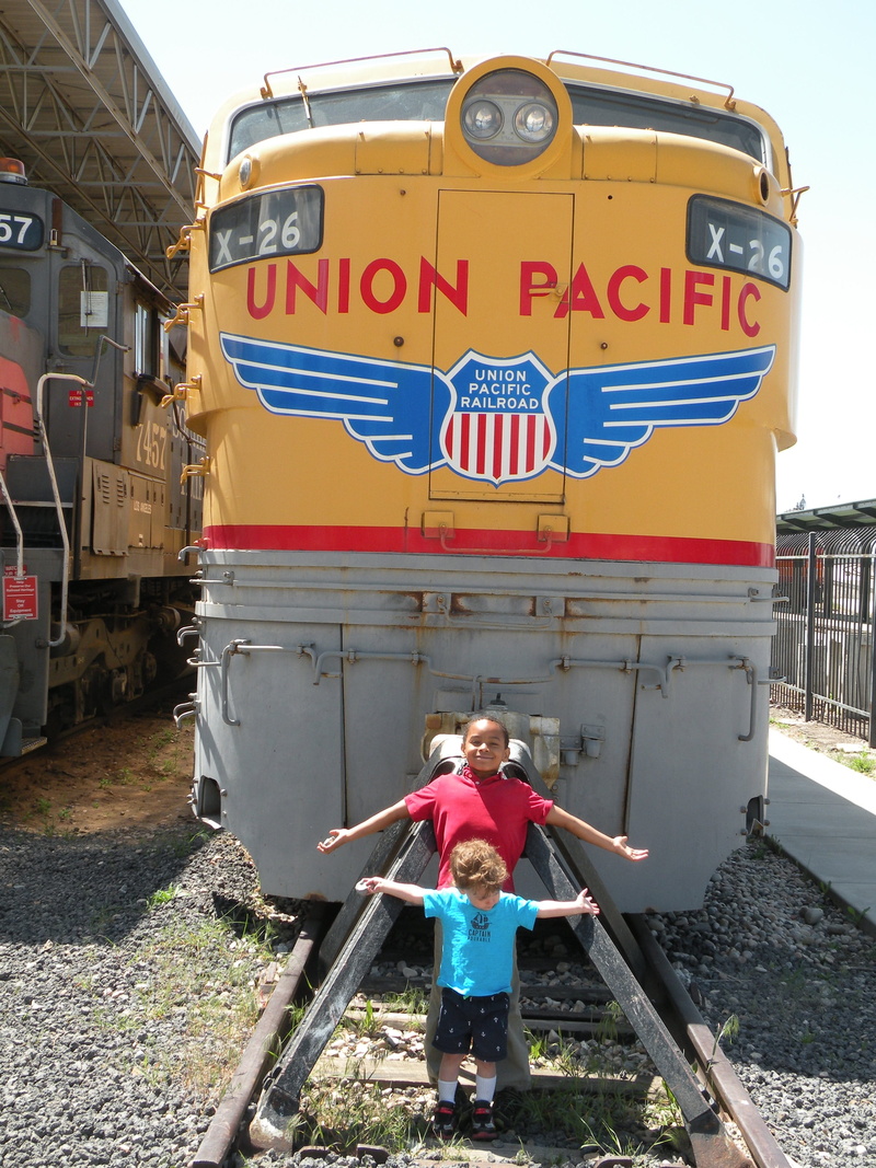 tracks, union pacific, lifestyles, railroad, child, boys, women, front view, kids, train, day, nature, rail transportation, real people, casual clothing