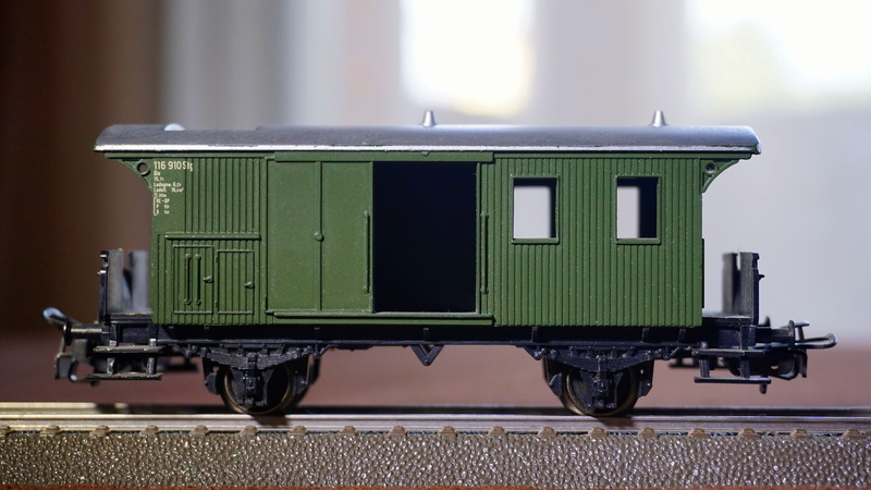 domestic room, no people, focus on foreground, wagon, transport, goods, old, mode of transportation, road, industry, outdoors, technology, back lit, railway