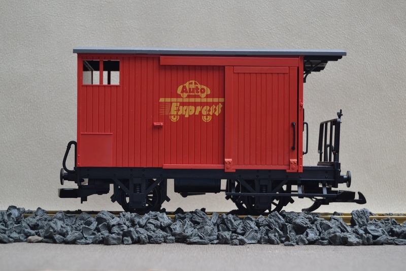 built structure, day, container, outdoors, garden railway, goods wagons, wheel, communication, mode of transportation, freight transportation, no people