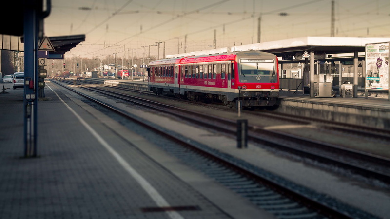 built structure, freight train, railway station, motion, railroad station platform, outdoors, railroad station, station, railway, no people, travel, leaving