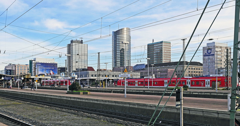 train - vehicle, electricity, cityscape, railroad track, outdoors, remote tracks, built structure, transportation, s-bahn-terminal, power supply, track climb