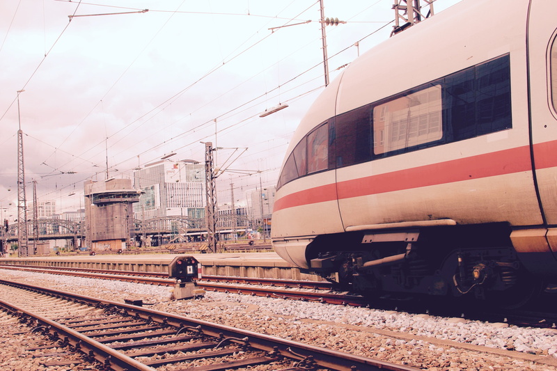 day, railroad track, railway station, travel, rail transportation, public transportation, signal box, one person, cable, mode of transportation, railroad car
