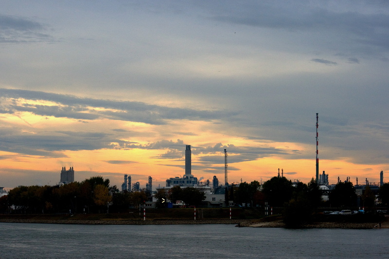 water, smoke - physical structure, factory, building exterior, industry, sunset, no people, fuel and power generation, built structure, tree, sky, environmental issues