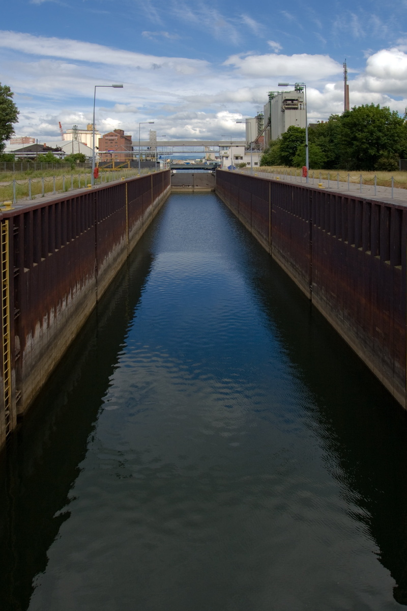 nature, sky, architecture, diminishing perspective, bridge, reflection, building exterior, river, built structure, no people, waterfront, railing, cloud - sky