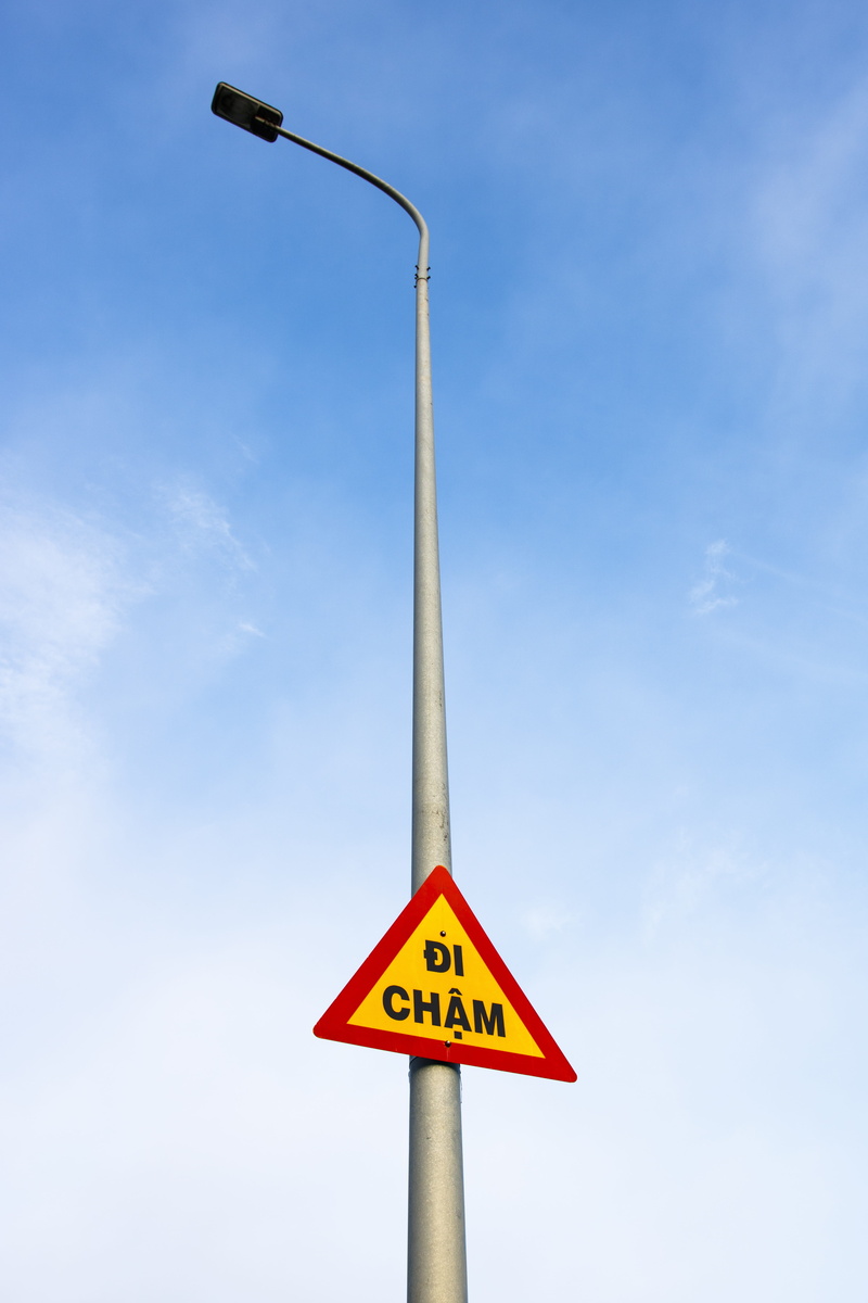 red, western script, blue, road warning sign, traffic signal, road sign, 5K, sky, bar, street, post, cloud - sky, isolated, triangle shape, guidance, communication