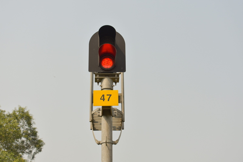 day, lighting equipment, yellow, road signal, safety, no people, communication, red signal, form of communication, outdoors, transportation, road sign