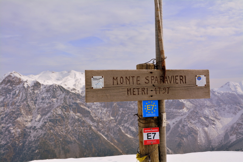 text, road sign, mountain peak, nature, cloud - sky, day, signal, snowcapped mountain, travel, symbol, cold temperature, snow, sign, directional sign, guidance