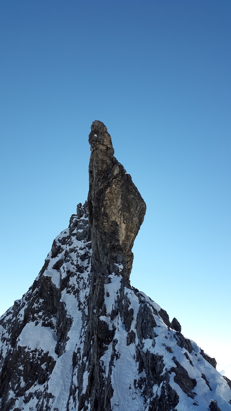 no people, blue, sky, snowcapped mountain, signal head, mountain, pinnacle, mountain peak, rock formation, winter, beauty in nature, low angle view, scenics