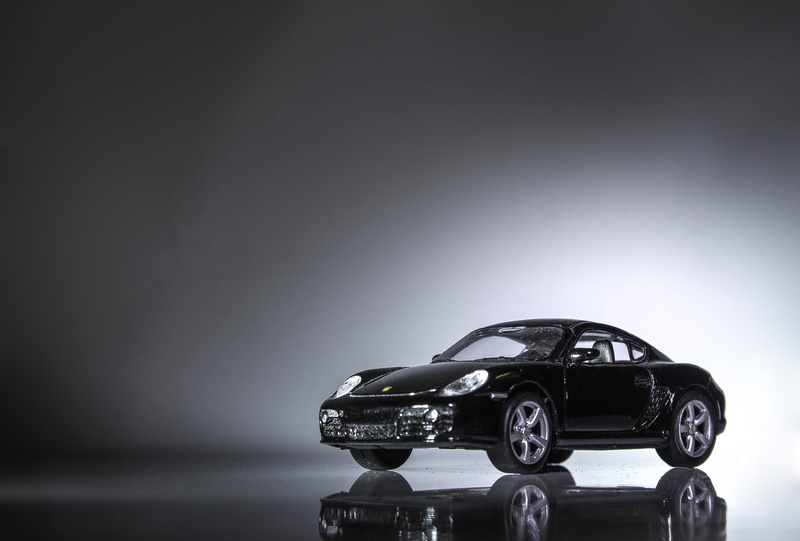 porsche, machine, car, hotspot, light, indoors, no people, gray background, motor vehicle, sports, technology, silver colored, coupe, studio shot, table