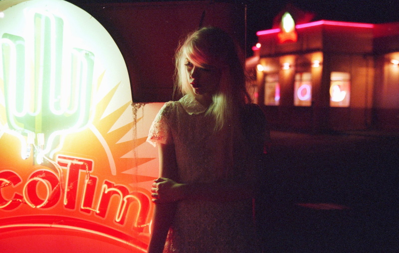 communication, real people, front view, women, lighting equipment, adult, young adult, leisure activity, one person, night, hairstyle, neon, neon sign