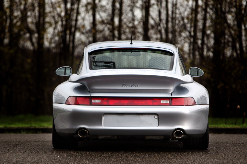 2K, vintage car, no people, stationary, 1996, turbo, nature, car, focus on foreground, retro styled, 993, toy, land vehicle, coupe, chrome, supercar, forest