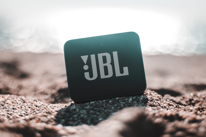 surface level, number, global communications, beach, jbl, land, fence, day, sun, stone - object, electronics, nature, selective focus, focus on foreground