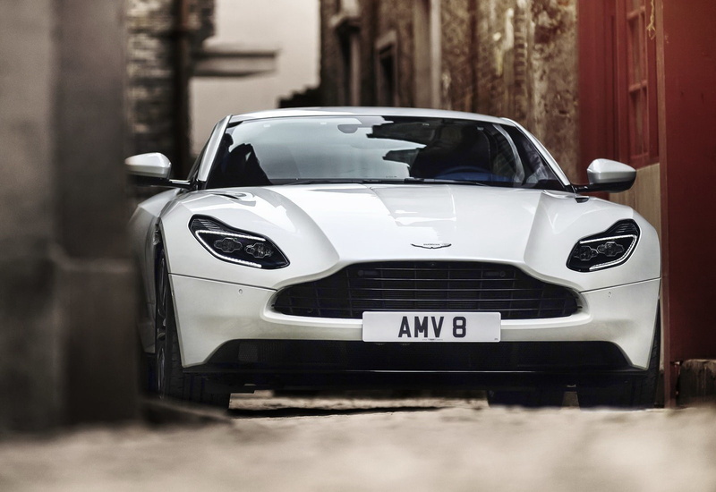 text, car, (2018), motor vehicle, city, aston, land vehicle, street, day, building exterior, db11, martin, focus on foreground, no people, outdoors, transportation