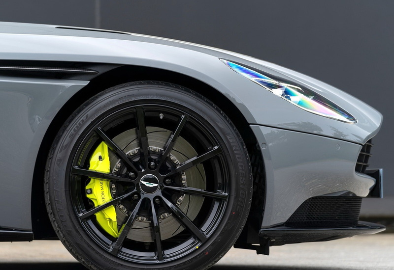 mode of transportation, black color, motor vehicle, amr, transportation, travel, speed, car, luxury, stationary, reflection, technology, day, spoke, outdoors