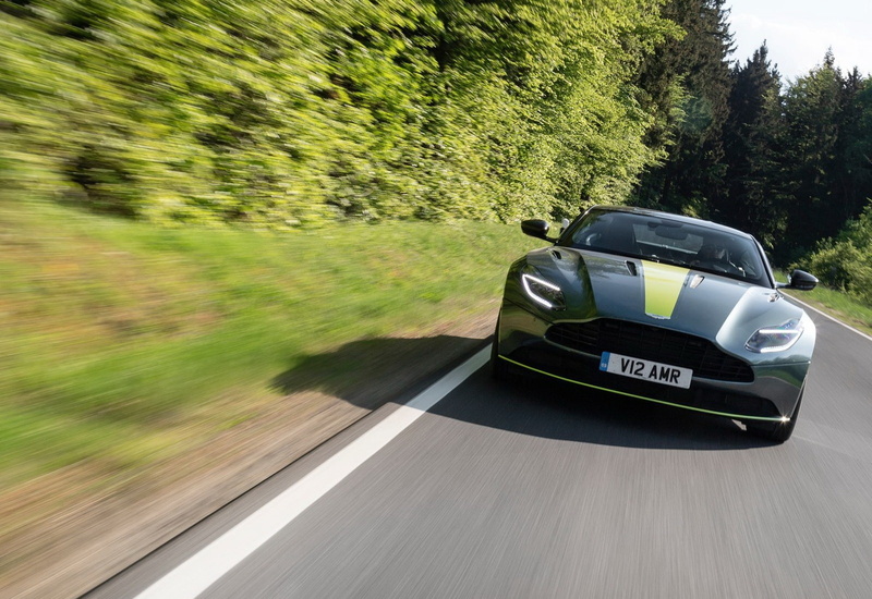 text, aston, on the move, 720P, road trip, nature, western script, mode of transportation, no people, car, outdoors, day, blurred motion, tree, land vehicle