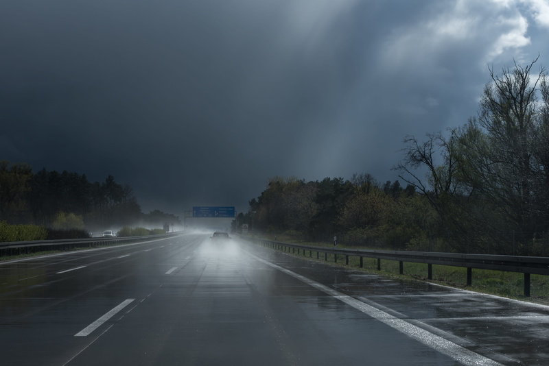 symbol, plant, mood, highway, cloud - sky, refraction, clouds, tree, nature, backlighting, mode of transportation, rain, hydroplaning, road, outdoors, weather phenomenon