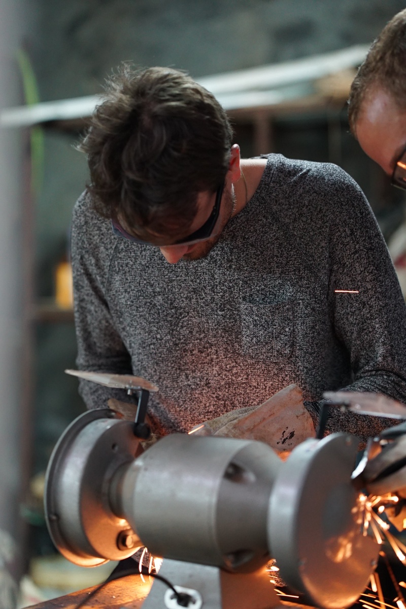 focus on foreground, nuts, screw, industry, craftsmen, occupation, machine, real people, child, lifestyles, grinding, casual clothing, work, craft, grinding machine