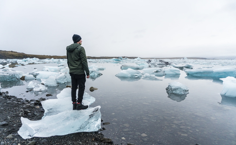 lake, alone, snow, jacket, environment, sea, one person, people, near, beauty in nature, standing, cold, young adult, looking at view, outdoors, day, nature