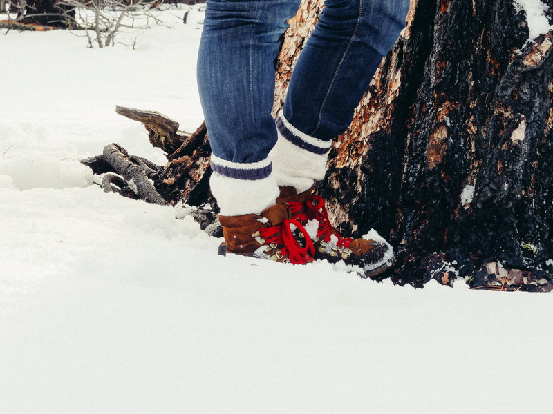jeans, one woman only, socks, standing, red, field, white color, denim, covered, warm clothing, land, leisure activity, cold, adventure, only women, winter