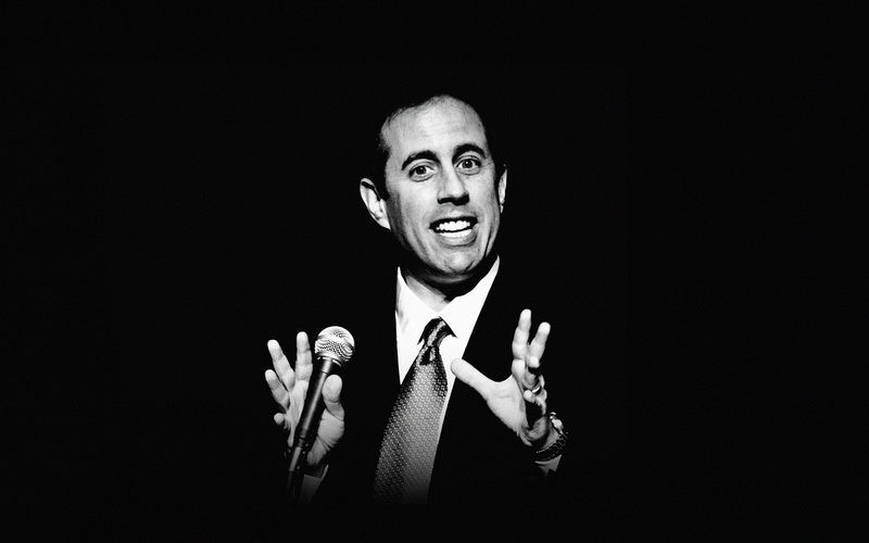 males, comedian, 4K, looking at camera, smiling, portrait, studio shot, front view, gesturing, businessman, suit, business, adult, men, black background