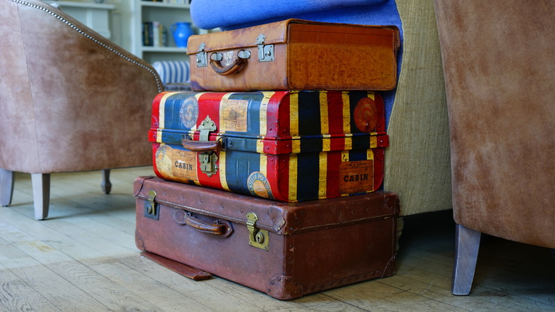 airport, no people, box, wall - building feature, in a row, lounge, near, luggage, focus on foreground, abundance, trip, bags, color, assorted, indoors