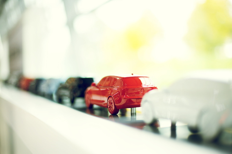 light, car, cast, vehicles, mode of transportation, no people, exhibition, selective focus, 4K, business, day, toy car, die, red, outdoors, series, bmw