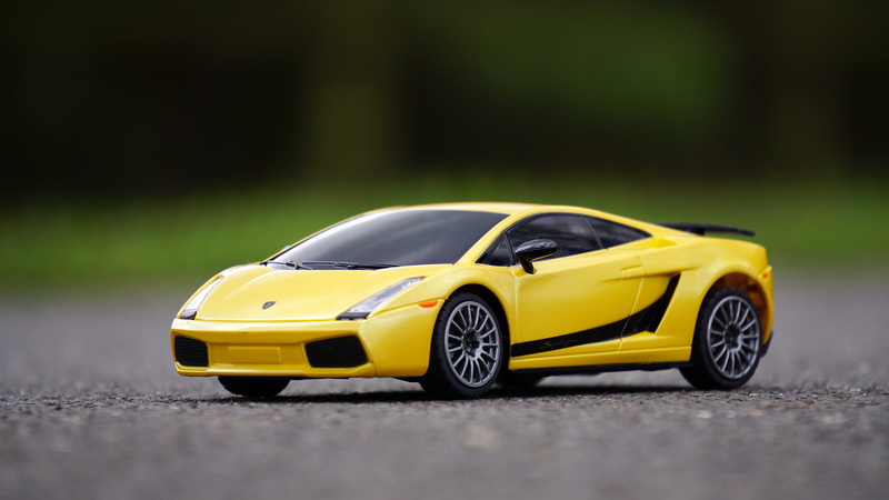 drive, selective focus, car, motor vehicle, mode of transportation, lamborghini, yellow taxi, model, yellow, auto, motion, transportation, toy, die, sport