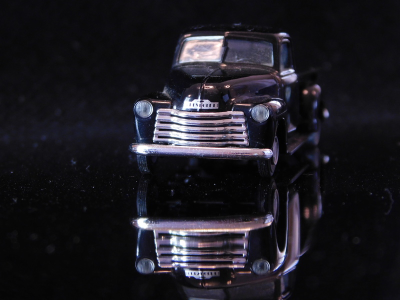 black color, motor vehicle, nobody, color, car, single object, indoors, a collection of, auto, toy vehicle, gift, stack, 4K, focus on foreground, studio shot