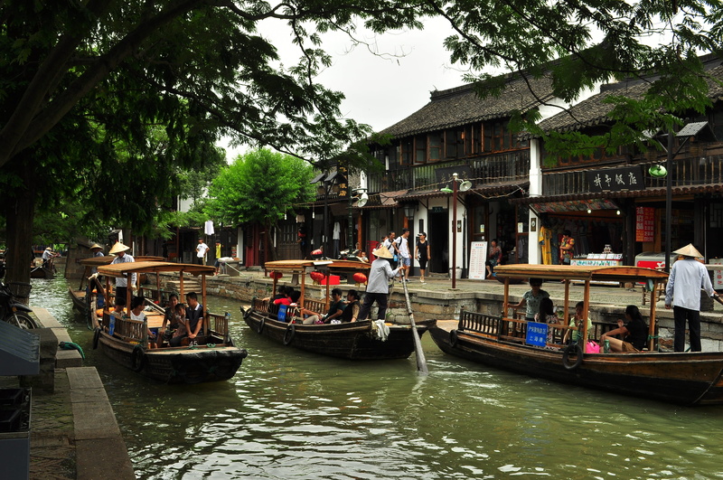 village, building exterior, day, crowd, tree, nature, adult, plant, transportation, mode of transportation, china, waterfront, water, large group of people
