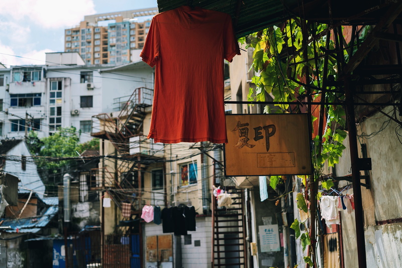 text, building, western script, old, day, window, residential district, outdoors, sign, no people, apartment, clothes, architecture, communication, nature