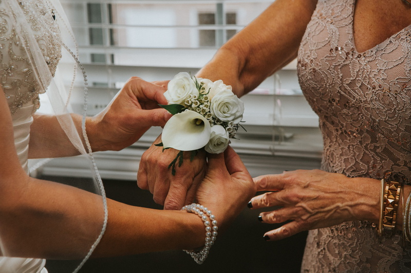 event, mother, adult, wrist, positive emotion, newlywed, ceremony, wrislet, human body part, flower arrangement, flower, corsage, hand, 5K, life events