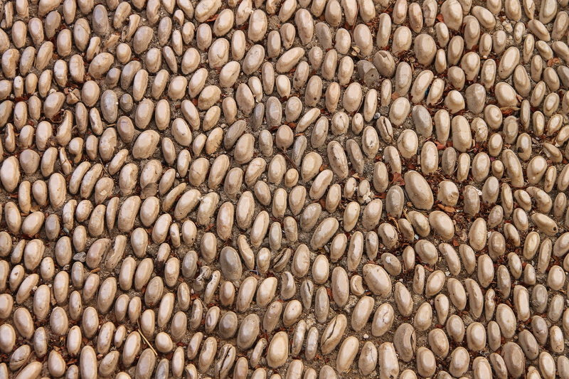 used, pattern, structure, arranged, large group of objects, textured, oval, brown, abundance, day, outdoors, food, sidewalk, healthy eating, food and drink