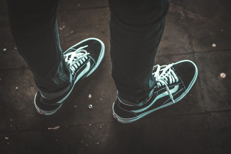 one person, lace - fastener, body part, shoe, 5K, wearing, outdoors, low section, canvas shoe, lifestyles, old, standing, real people, human body part