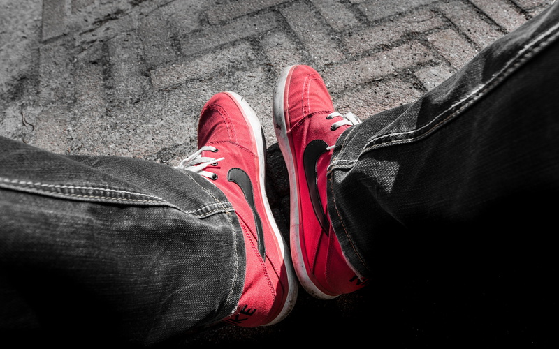 high angle view, standing, casual clothing, 4K, man, sneakeres, person, outdoors, nike, sitting, black swoosh, real people, human foot, body part, leather