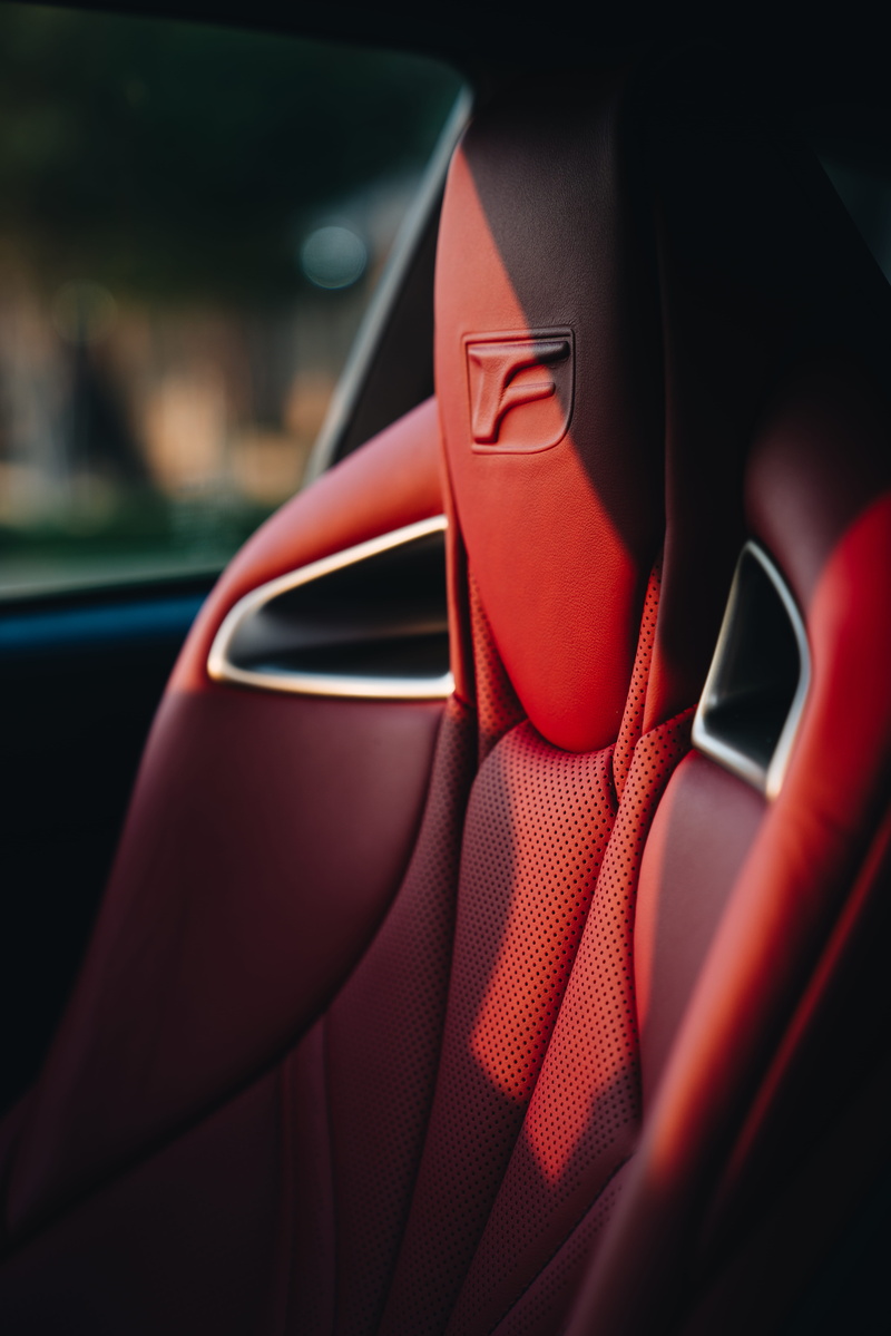 vehicle interior, fashion, 8K, interior, close-up, motor vehicle, selective focus, human, clean, car, race car, transportation, high heel, travel, seat