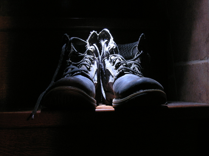 relaxation, leather, body part, indoors, dark, retro, absence, 2K, clothing, no people, shoe, flooring, brown, style, black, black background, still life