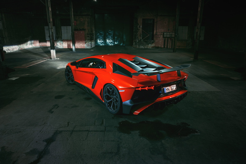 built structure, vehicle, stationary, motor vehicle, red cars, outdoors, coupe, mode of transportation, no people, city, toy, sports car, architecture