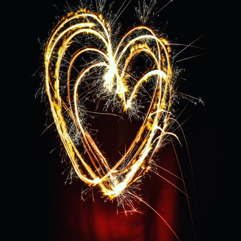 black background, arts culture and entertainment, love, light painting, glowing, no people, event, heart shape, light, positive emotion, sparkling, burning
