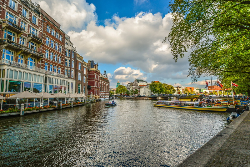 sky, concrete, boats, building exterior, transportation, city, holland, tourism, amsterdam, buildings, netherlands, canal, outdoors, nautical vessel, nature