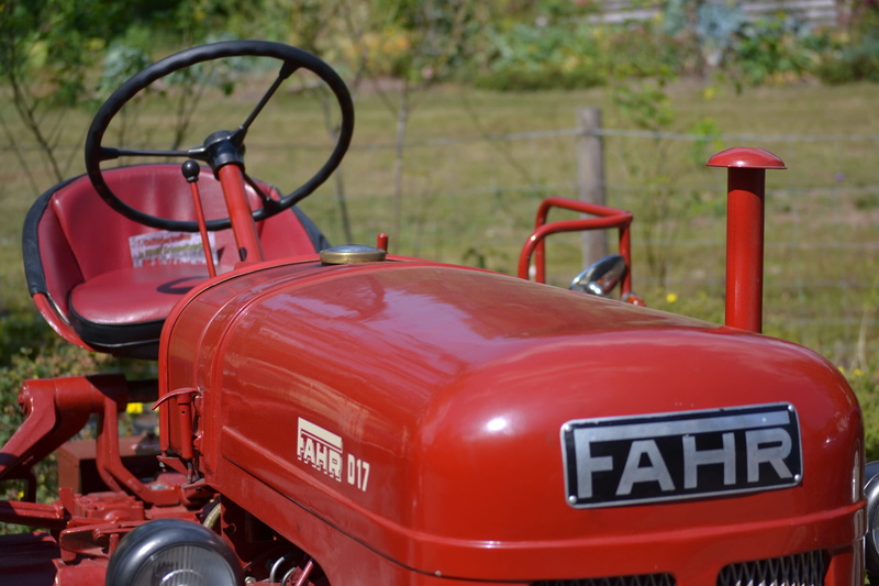 western script, outdoors, no people, motor vehicle, nostalgia, car, metal, fire engine, Tractor, communication, sign, farm, agricultural, focus on foreground