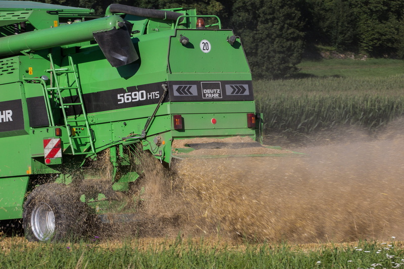 harvesting, mode of transportation, land vehicle, outdoors, chaff, number, harvester, agricultural Machinery, text, agricultural machine, nature, growth