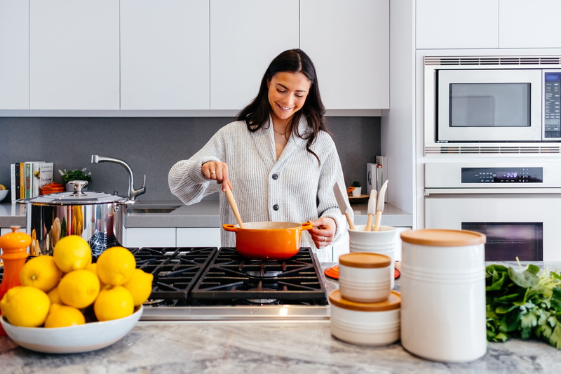 kitchen counter, lifestyles, cook, microwave, sink, le creuset, one person, household equipment, pot, coffee cup, women, front view, indoors, 5K, room