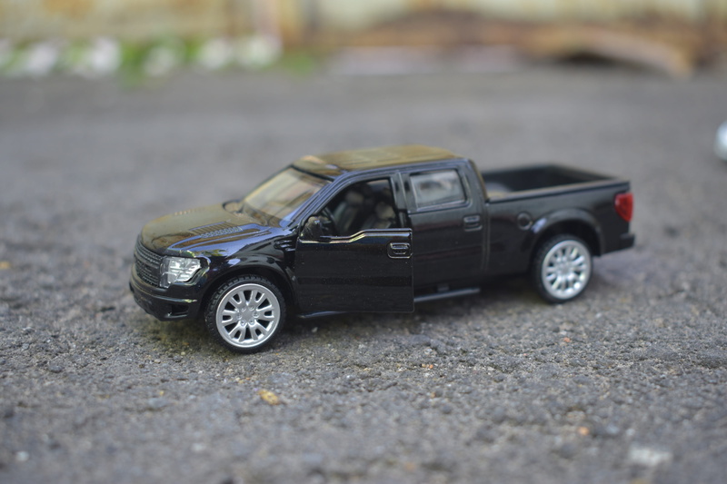 close-up, miniature, motor vehicle, city, mode of transportation, road, land vehicle, 4K, surface level, toy car, selective focus, vehicle, transportation