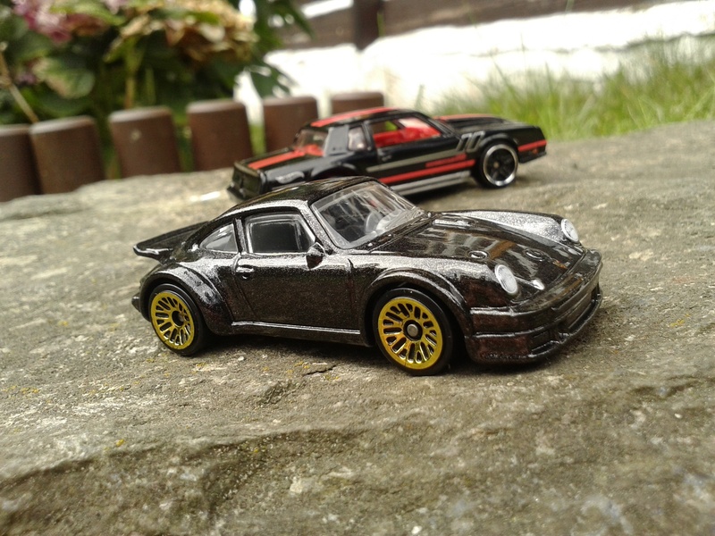 racecar, cars, 934 rsr, day, stationary, diecast, car, land vehicle, still life, childhood, close-up, small, transportation, toy, black, 2K, outdoors
