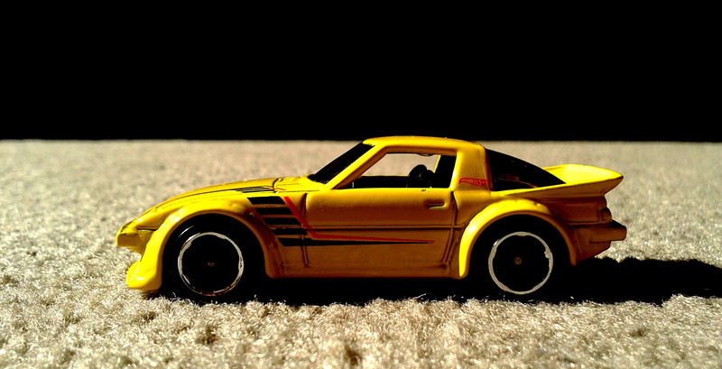 copy space, yellow, car, tuner, studio shot, outdoors, night, mode of transportation, black background, rx-7, hot wheels, no people, close-up, mazda, taxi